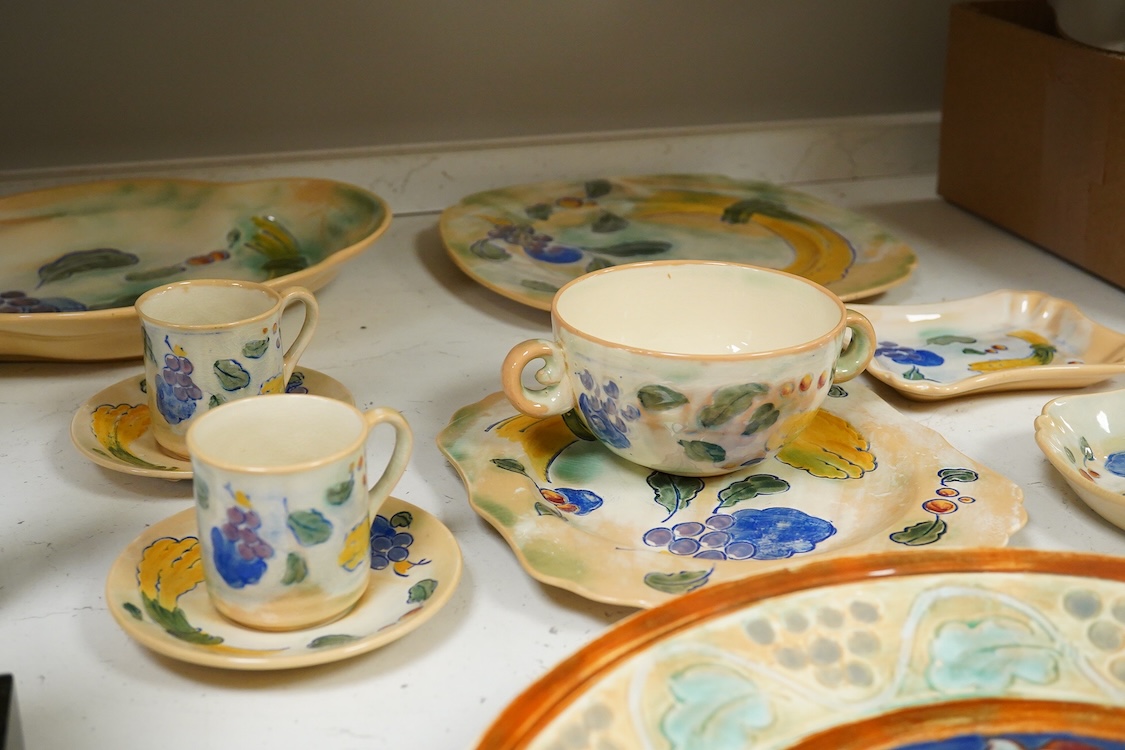 A collection of Doulton Brangwynware to include an oval dish, wall plate and two coffee cans and saucers, largest 32cm in diameter